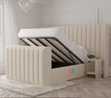 Cream upholstered tv bed with oversized headboard and storage made by heavenlybeds