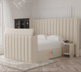 Beige upholstered tv bed with oversized headboard and storage made by heavenlybeds